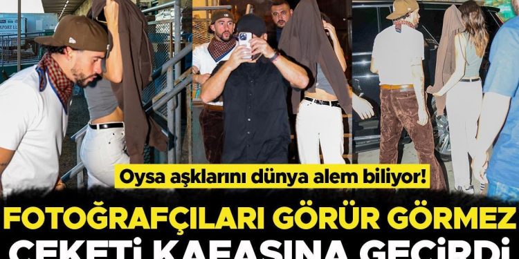 Dolu dizgin aşklarını hala herkesten saklamaya çalışıyorlar: Fotoğrafçıları görünce ceketini başına geçiriverdi